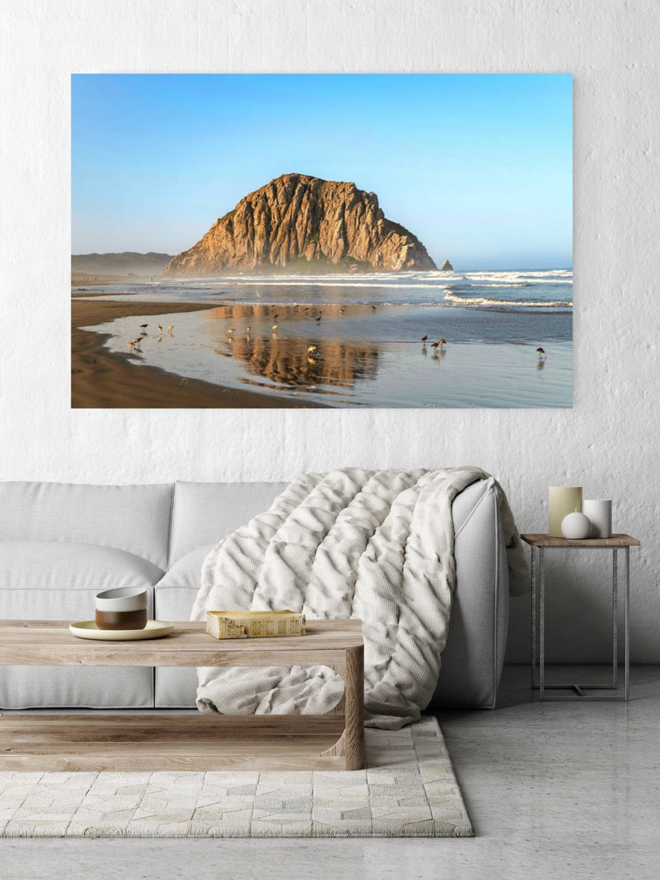 Beach scene with Morro Rock on a wall in a living room.