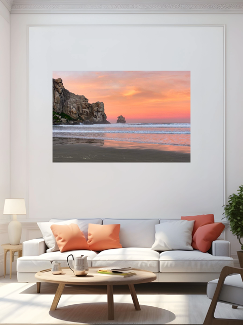 Living room with a large wall art of a beach sunrise above a white sofa with colorful cushions.