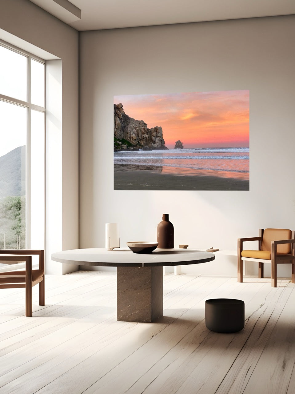 Modern living room with a large wall art of an ocean rock sunrise.