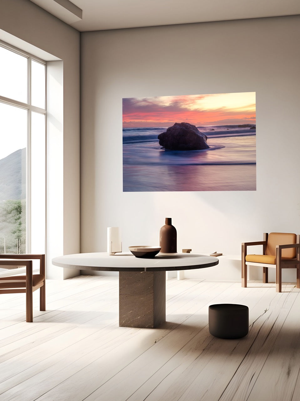 Modern living room with a canvas print of a large ocean rock on the wall.