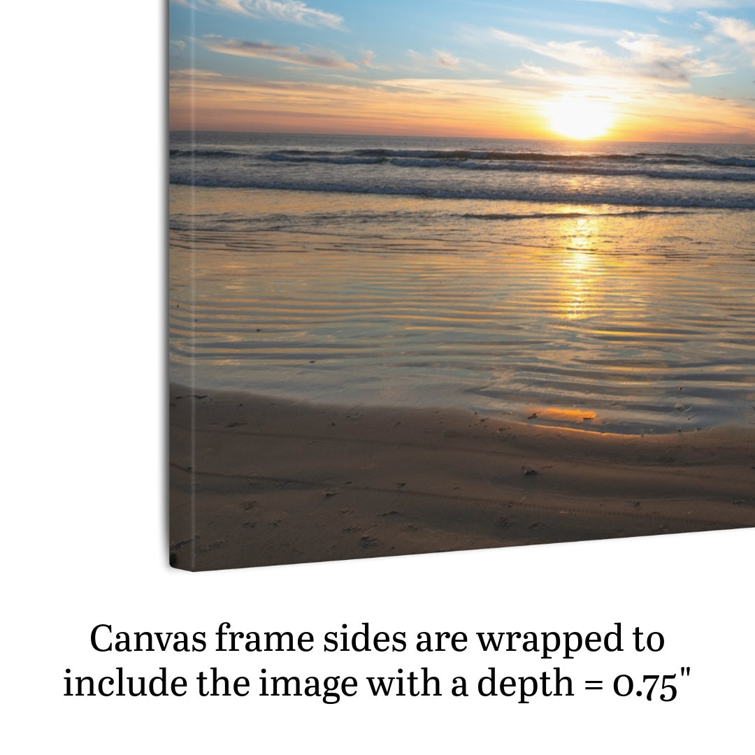 Side view of a California beach sunset over the ocean with golden sand ripples canvas print with text about frame depth.
