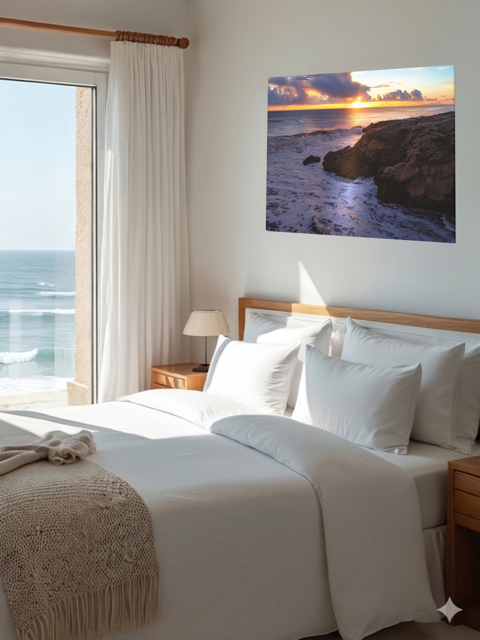 Bedroom with ocean view and a California coastal sunset after rain storm canvas print on wall