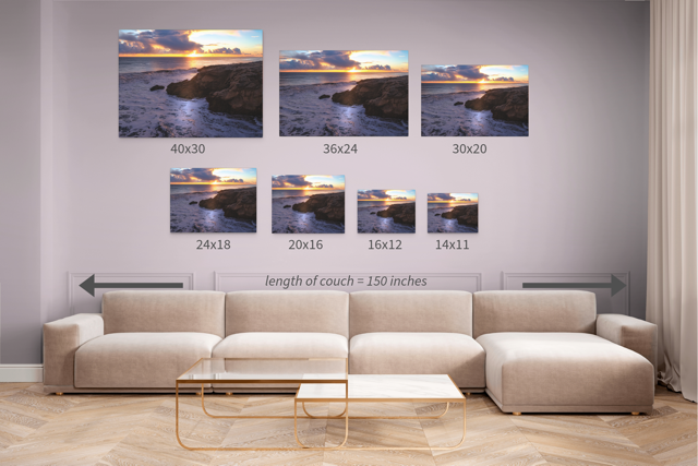 Living room with a beige sectional sofa and wall art displaying various sizes of a coastal scene.