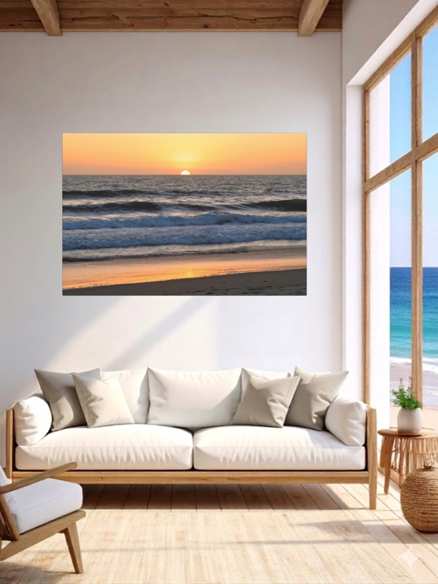 Living room with a Pacific Ocean sunset and waves on beach canvas print.