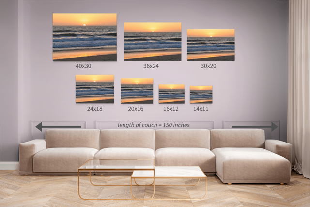 Wall art prints of beach scenes above a sofa with dimensions displayed