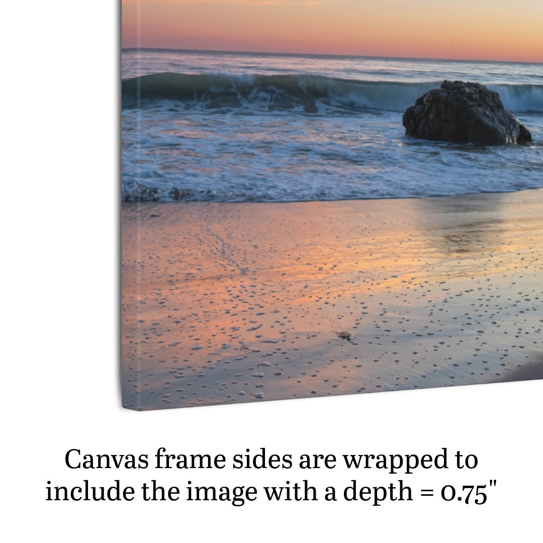 Side view of a pastel beach twilight canvas print with pink clouds reflecting on wet sand with text indicating frame depth.