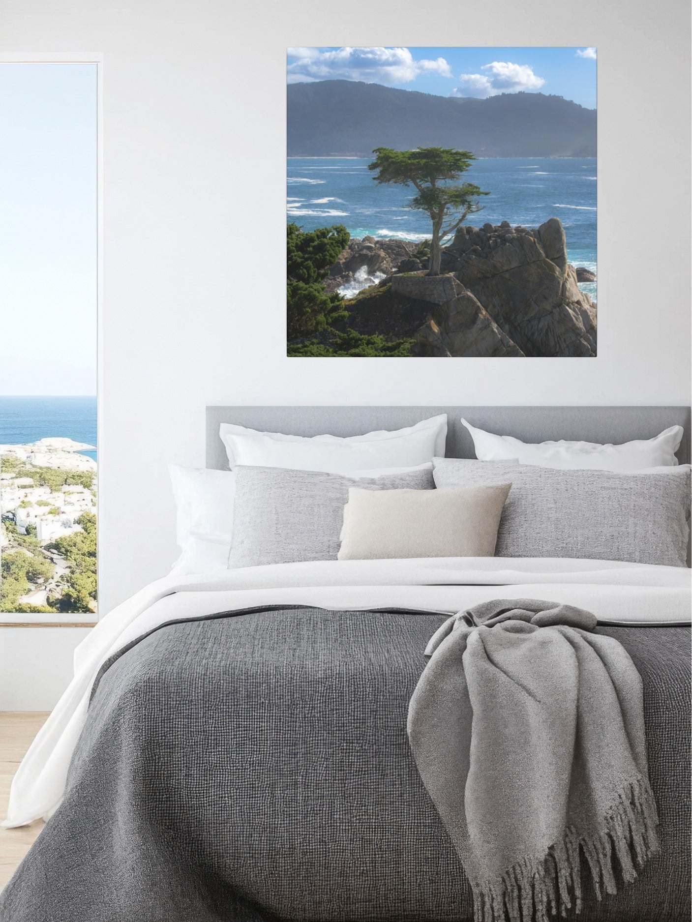 Bedroom with a canvas print of the lone cypress tree at Pebble Beach on a rocky cliff.