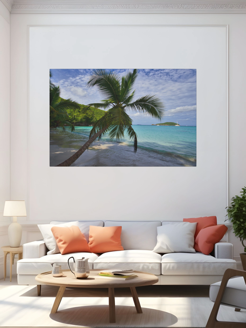 Living room with a canvas print of a tropical beach scene on the wall above a white sofa with colorful cushions.