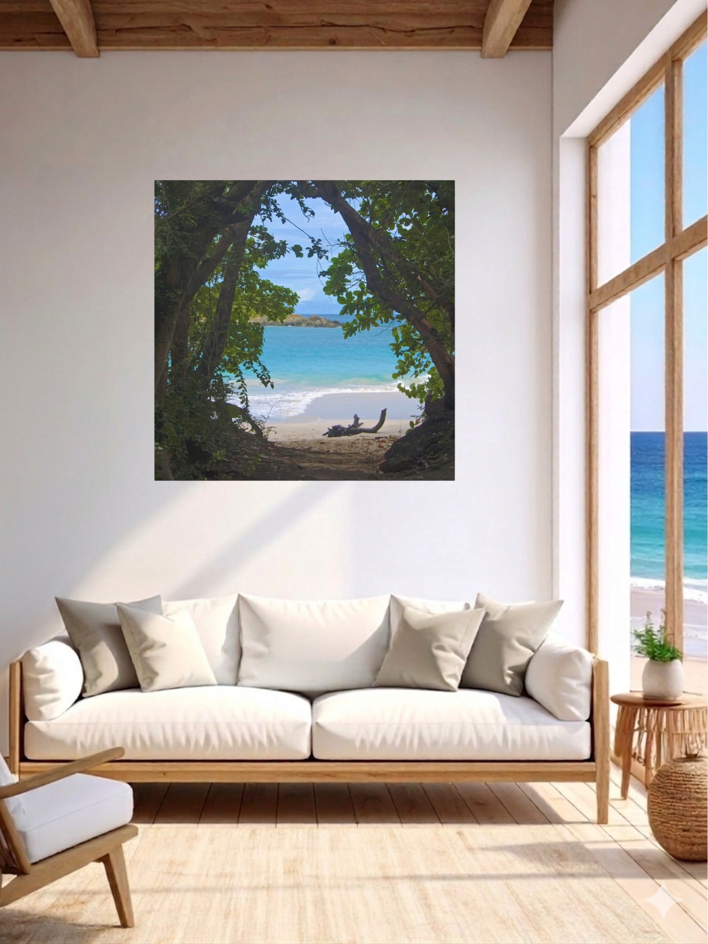 Living room with a large window and a tropical beach view through trees Hawaiian island canvas print on the wall.