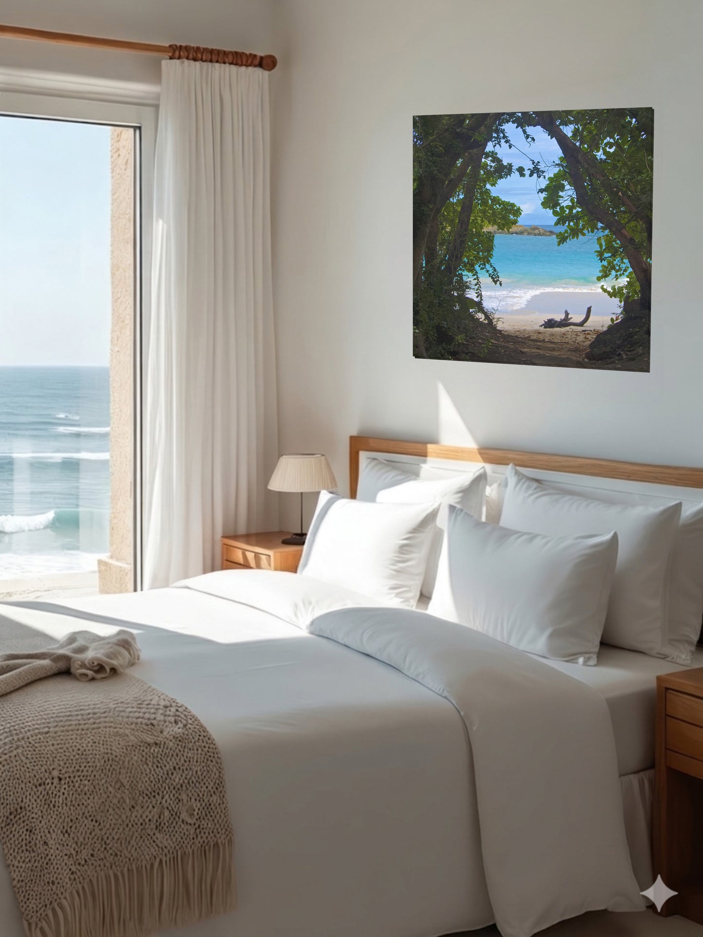 Bedroom with a large bed, ocean view, and tropical beach view through trees Hawaiian island canvas print on the wall.