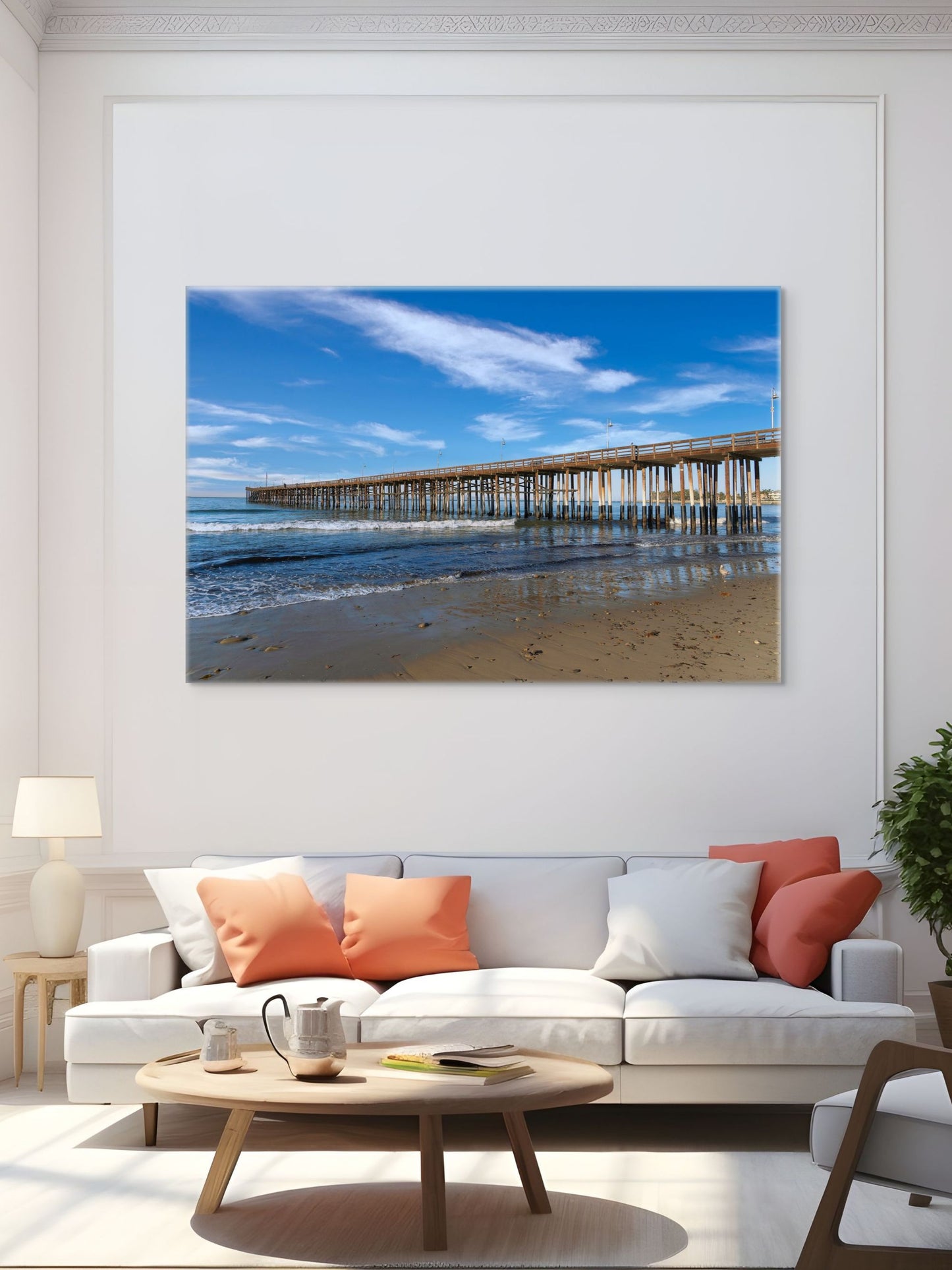 Living room with a large canvas print of Ventura Pier in California on the wall.