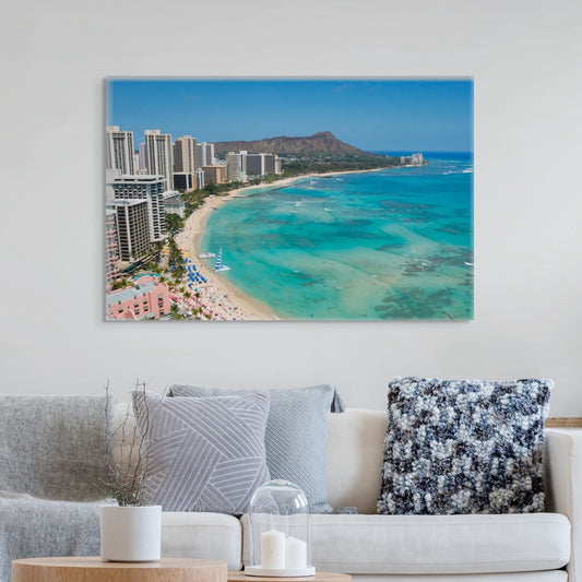 Living room with a large canvas print of an overhead view of the beach and hotels on Waikiki Beach in Hawaii with Diamond Head in the background
