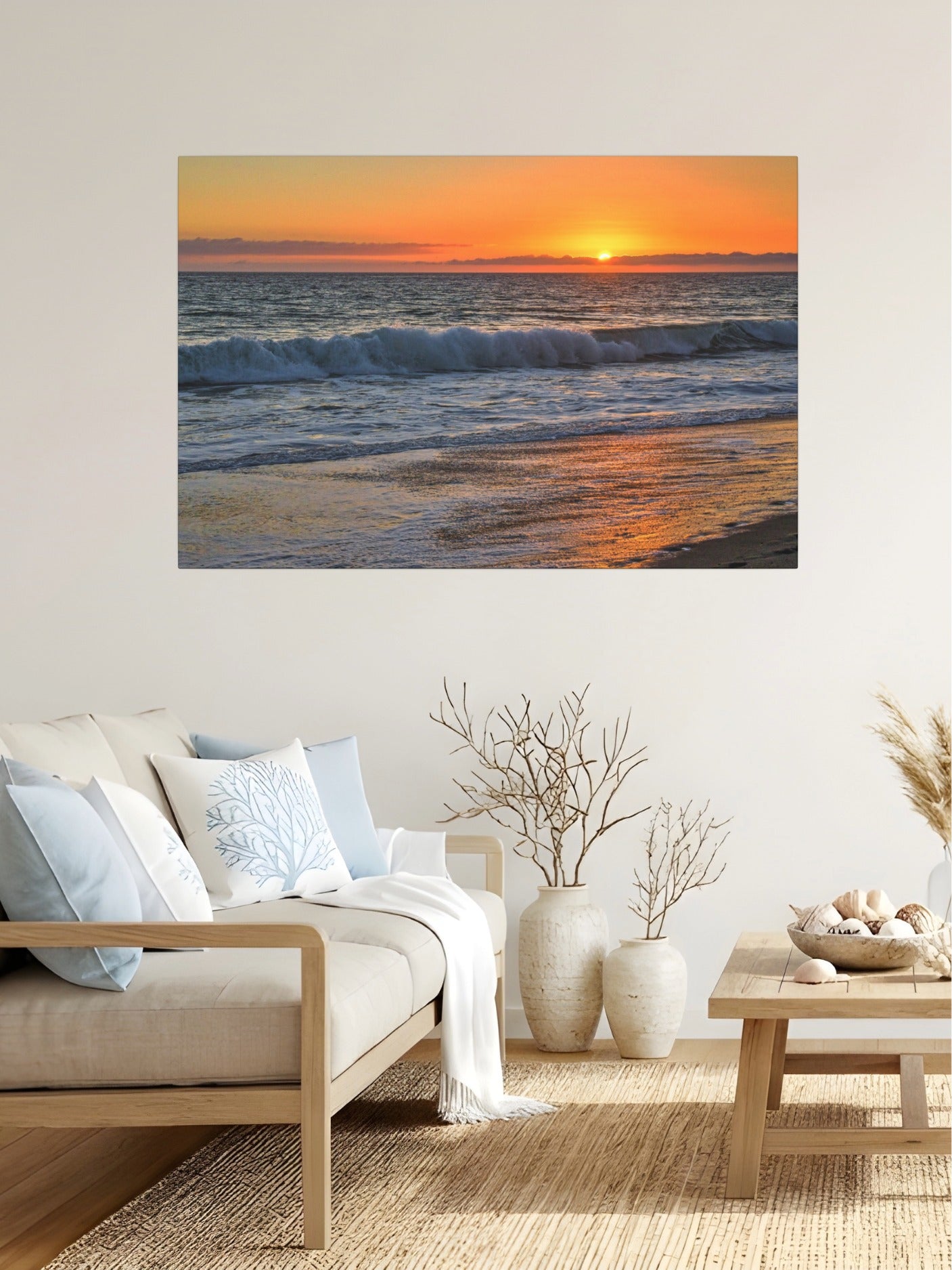 Living room with a canvas print of a Zuma Beach sunset in Malibu California with golden sky and reflective sand on the wall.